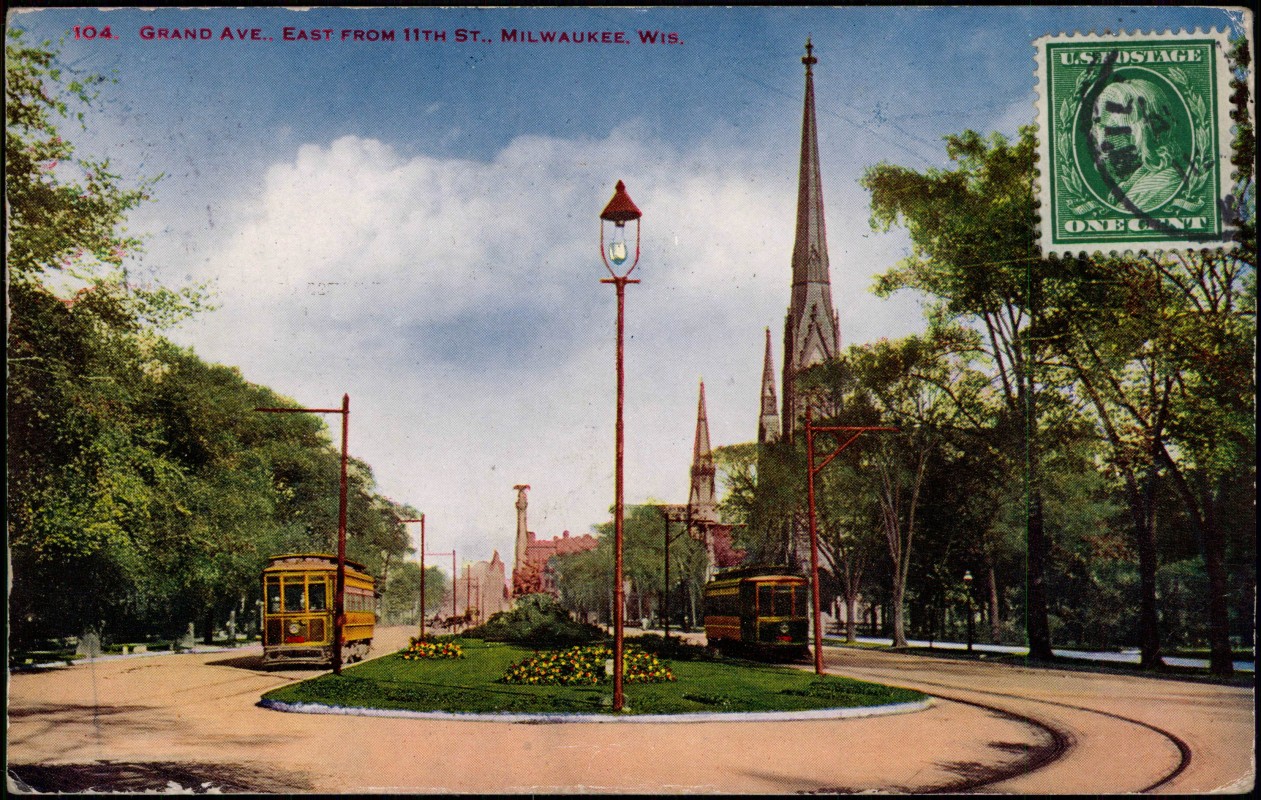 zoom: Image side vintage Postcard from 1928: 104 GRAND AVE. - EAST FROM 11TH Street:: Milwaukee