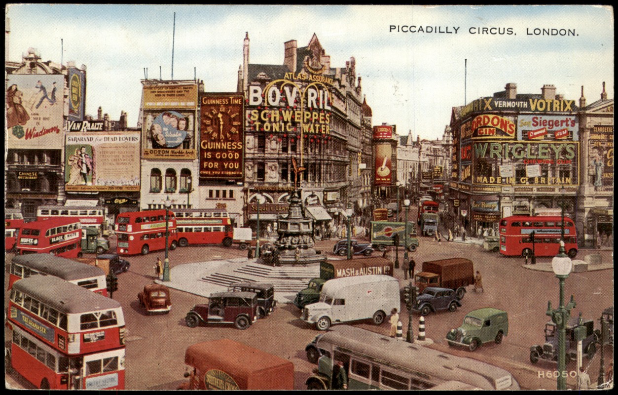 vergrößern: Bildseite historische Ansichtskarte von 1956: Piccadilly Circus mit Eros-Statue und Leuchtreklamen:: London